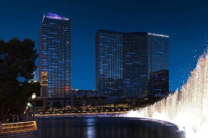 The Cosmopolitan towers in Las Vegas at night, overlooking the Fountain of Bellagio.